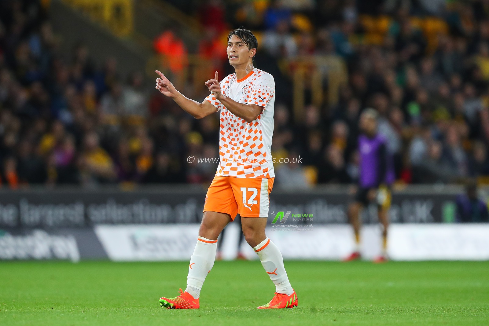 Kenny Dougall #12 of Blackpool gives his team instructions during the Carabao Cup match Wolverhampton Wanderers vs Blackpool at Molineux, Wolverhampton, United Kingdom, 29th August 2023

(Photo by Gareth Evans/News Images)