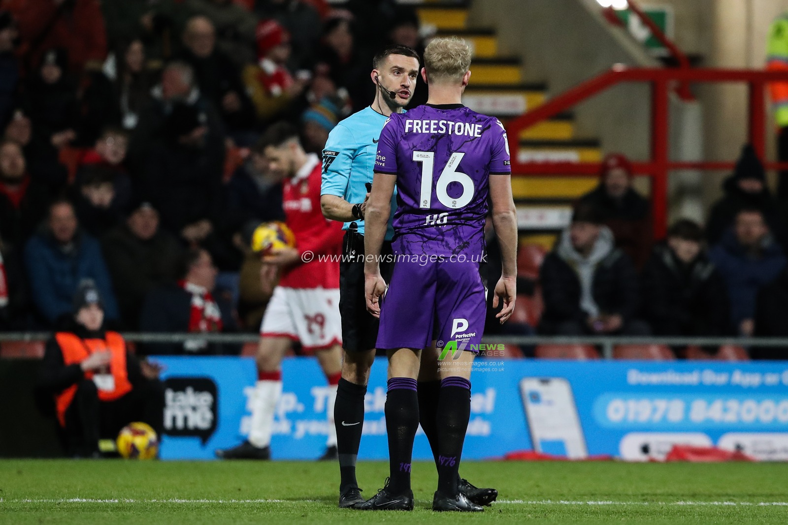 Referee Thomas Kirk checks on Lewis Freestone of Stevenage after a blow to the head during the Sky Bet League 1 match Wrexham vs Stevenage at SToK Cae Ras, Wrexham, United Kingdom, 28th January 2025

(Photo by Gareth Evans/News Images)