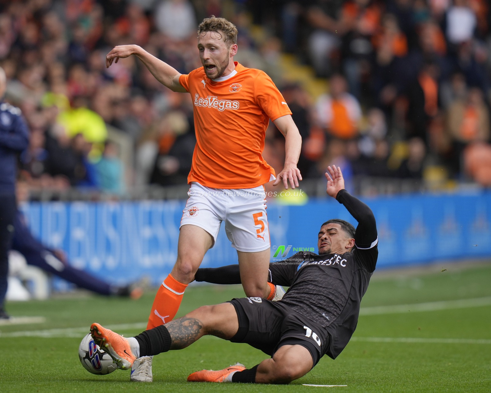 Josh Gordon #10 of Burton Albion dives into a tackle on Matthew Pennington #5 of Blackpool during the Sky Bet League 1 match Blackpool vs Burton Albion at Bloomfield Road, Blackpool, United Kingdom, 5th August 2023

(Photo by Steve Flynn/News Images)