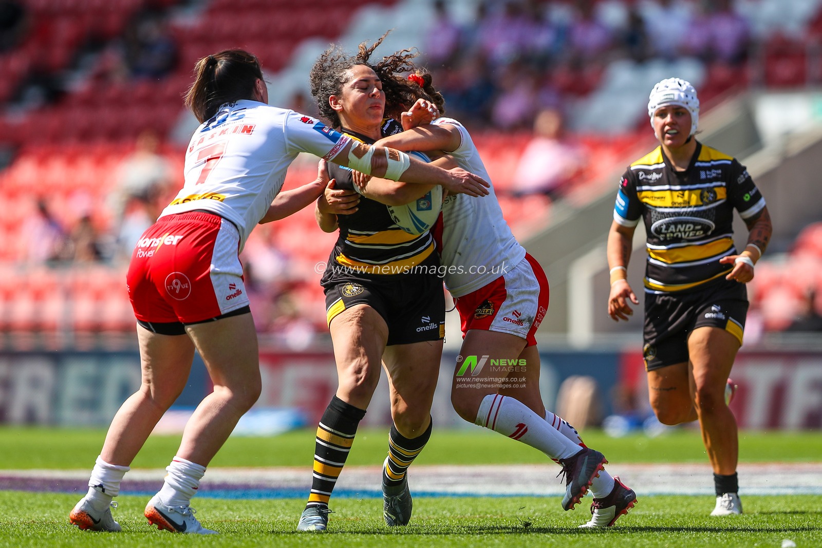 Savannah Andrade of York is tackled during the Betfred Women's Challenge Cup Semi-final match St Helens vs York City Knights at Totally Wicked Stadium, St Helens, United Kingdom, 11th May 2025

(Photo by Gareth Evans/News Images)