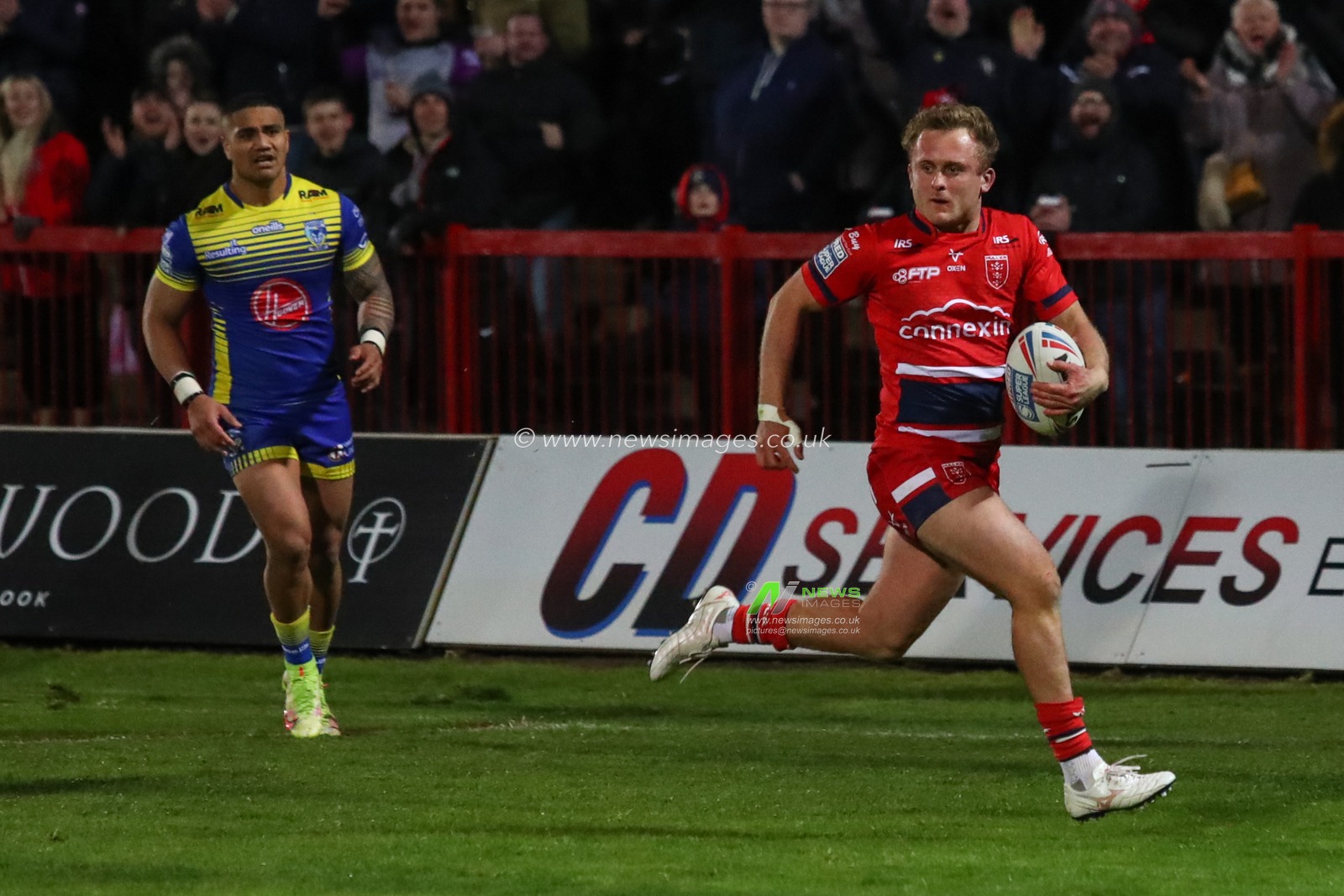 Jez Litten #14 of Hull KR makes a run for the try line