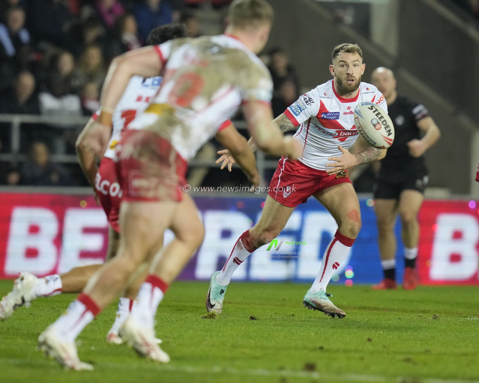 Daryl. Clark of St. Helens passes the ball during the Betfred Super League Round 1 match St Helens vs London Broncos at Totally Wicked Stadium, St Helens, United Kingdom, 16th February 2024

(Photo by Steve Flynn/News Images)