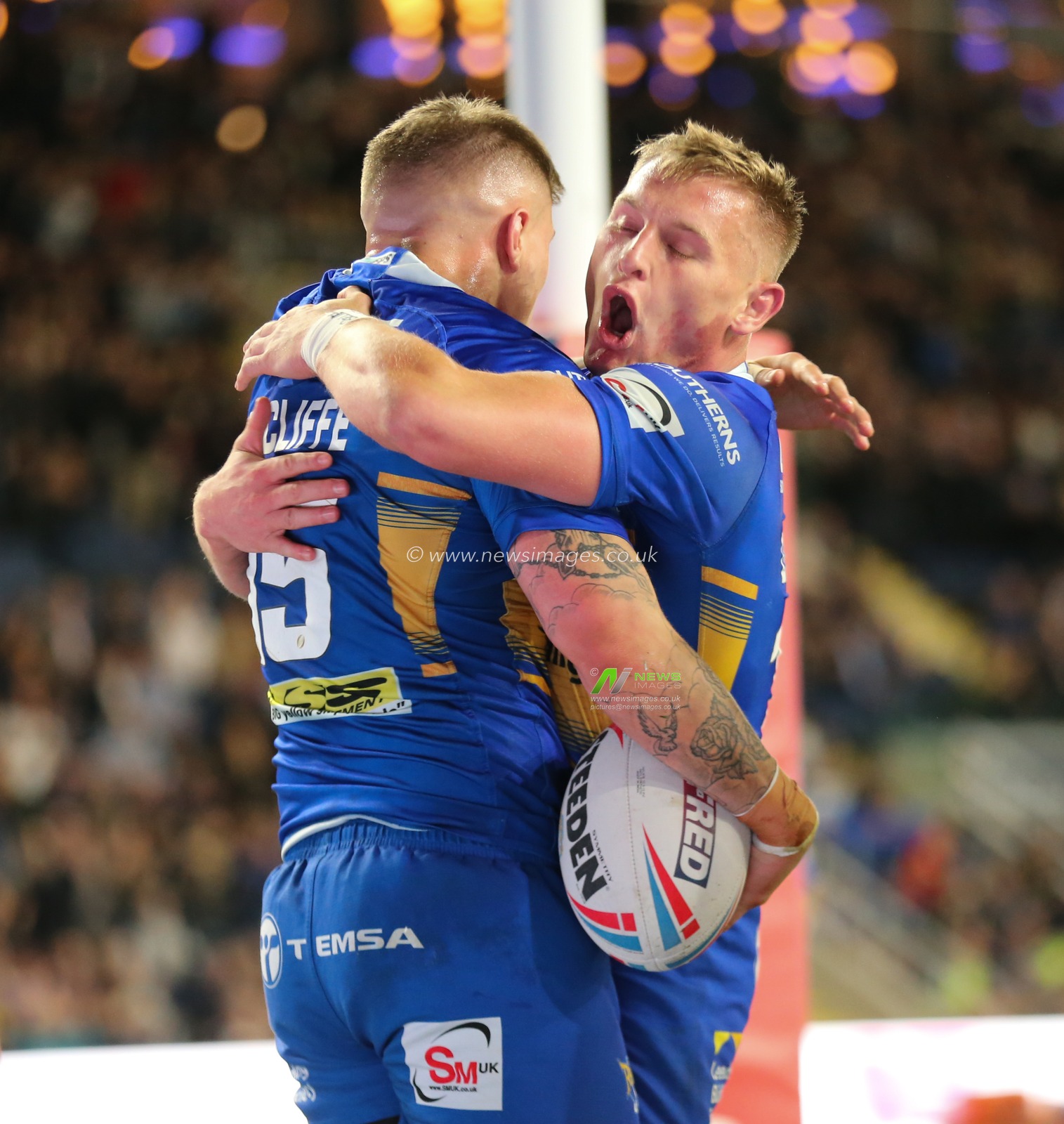 13th September 2019 , Emerald Headingley Stadium, England; Betfred Super League Rugby , Round 29, Leeds Rhinos vs Warrington Wolves ;  Liam Sutcliffe (15) of Leeds Rhinos  celebrates scoring the 1st try of the game with team mate Brad Dwyer (14).

Credit: Steve Gaunt/News Images