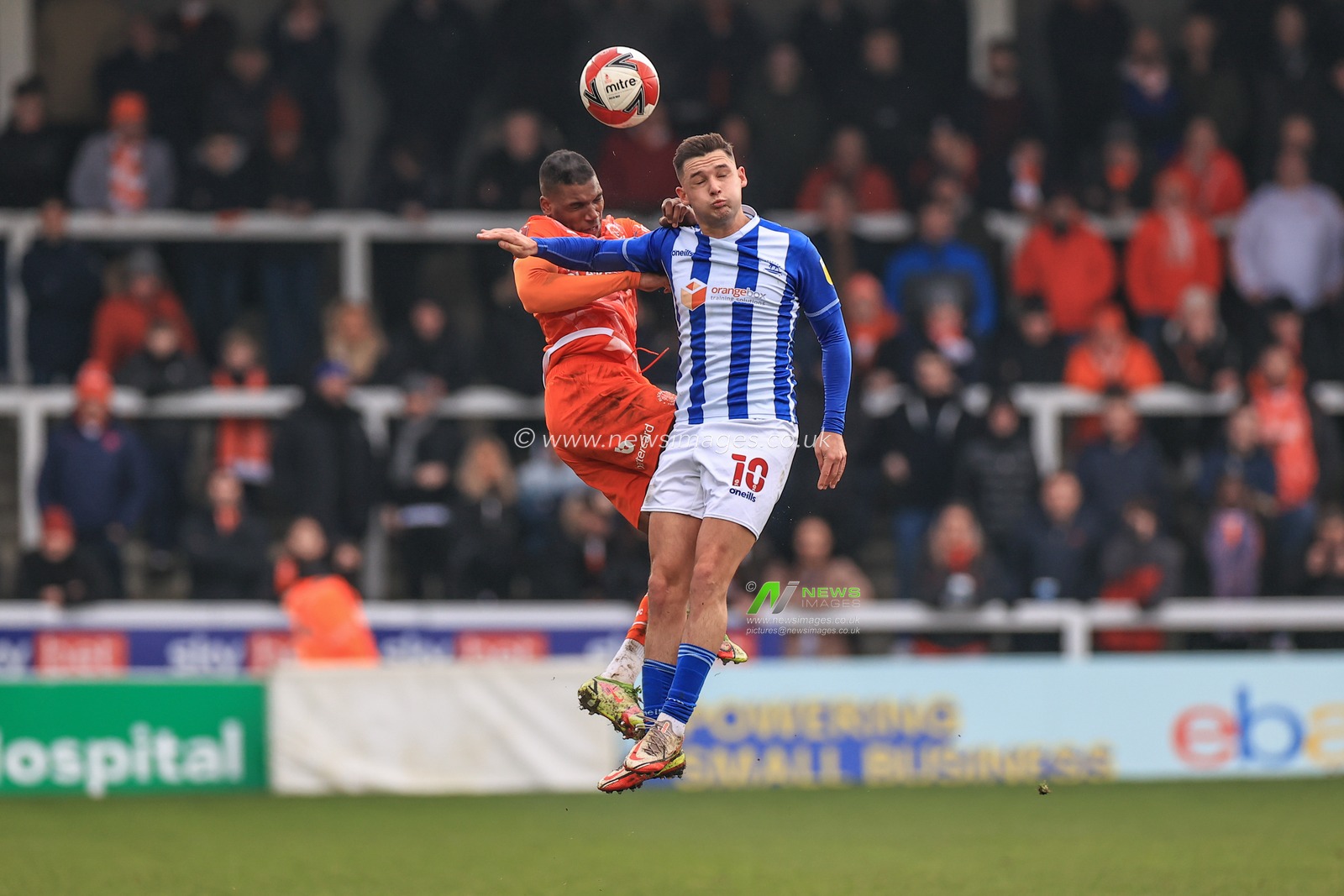 Dujon Sterling #35 of Blackpool and Luke Molyneux #10 of Hartlepool United battle for the ball
