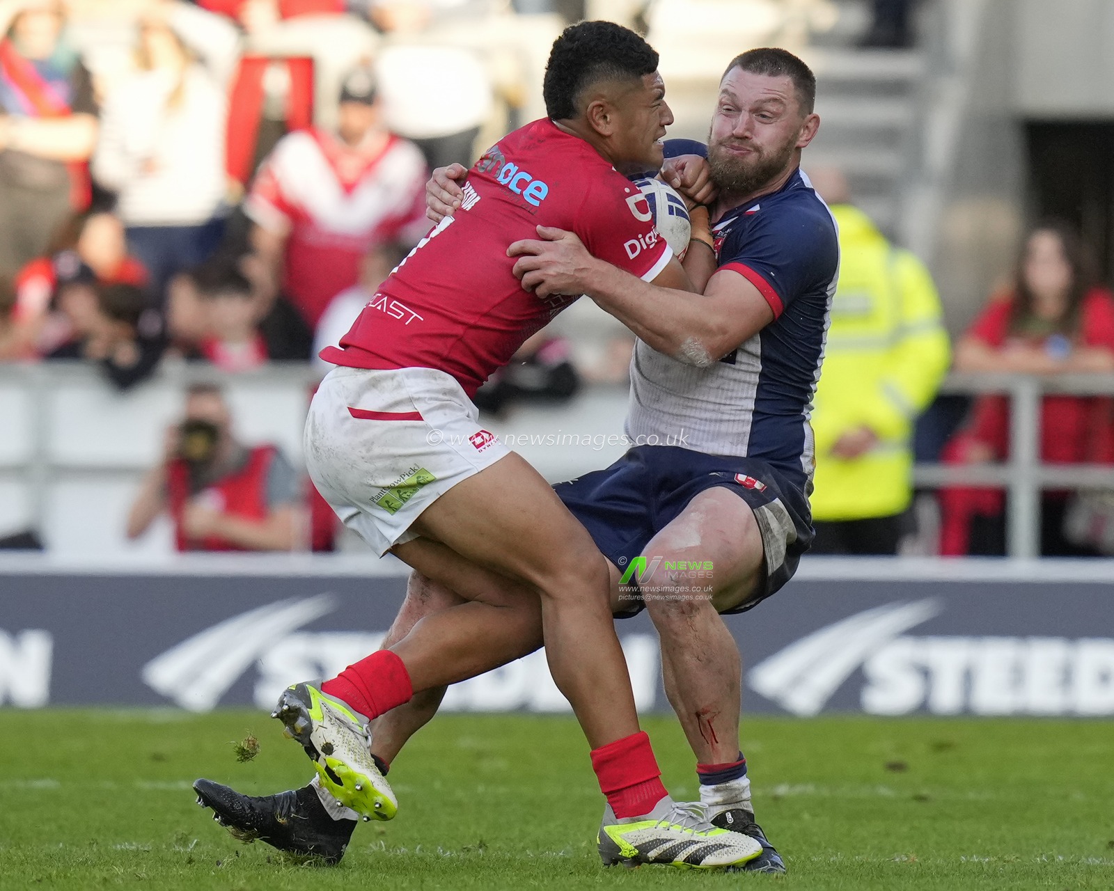 Elliott Whitehead #12 of England tackles Isaiya Katoa #7 of Tonga during the Rugby League International match England vs Tonga at Totally Wicked Stadium, St Helens, United Kingdom, 22nd October 2023

(Photo by Steve Flynn/News Images)