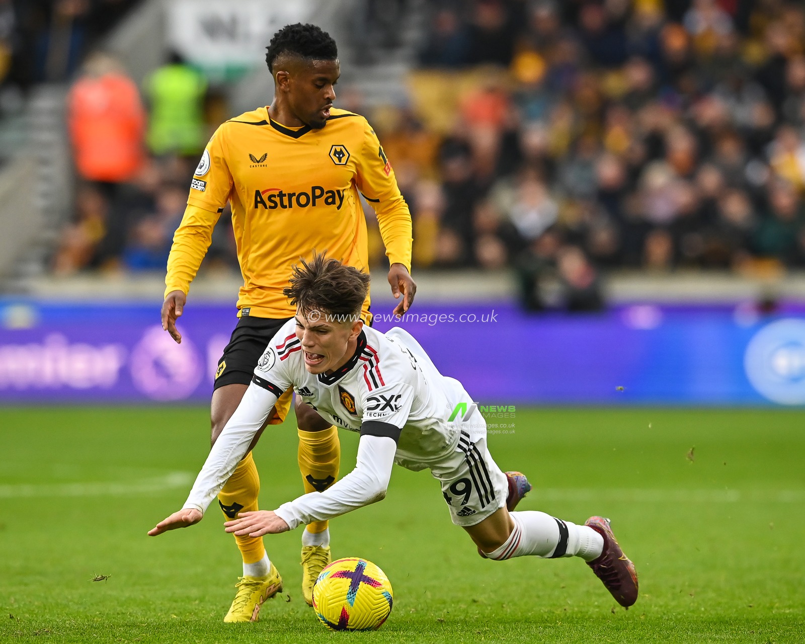 Alejandro Garnacho #49 of Manchester United is fouled by NÃ©lson Semedo #22 of Wolverhampton Wanderers during the Premier League match Wolverhampton Wanderers vs Manchester United at Molineux, Wolverhampton, United Kingdom, 31st December 2022

(Photo by Craig Thomas/News Images)