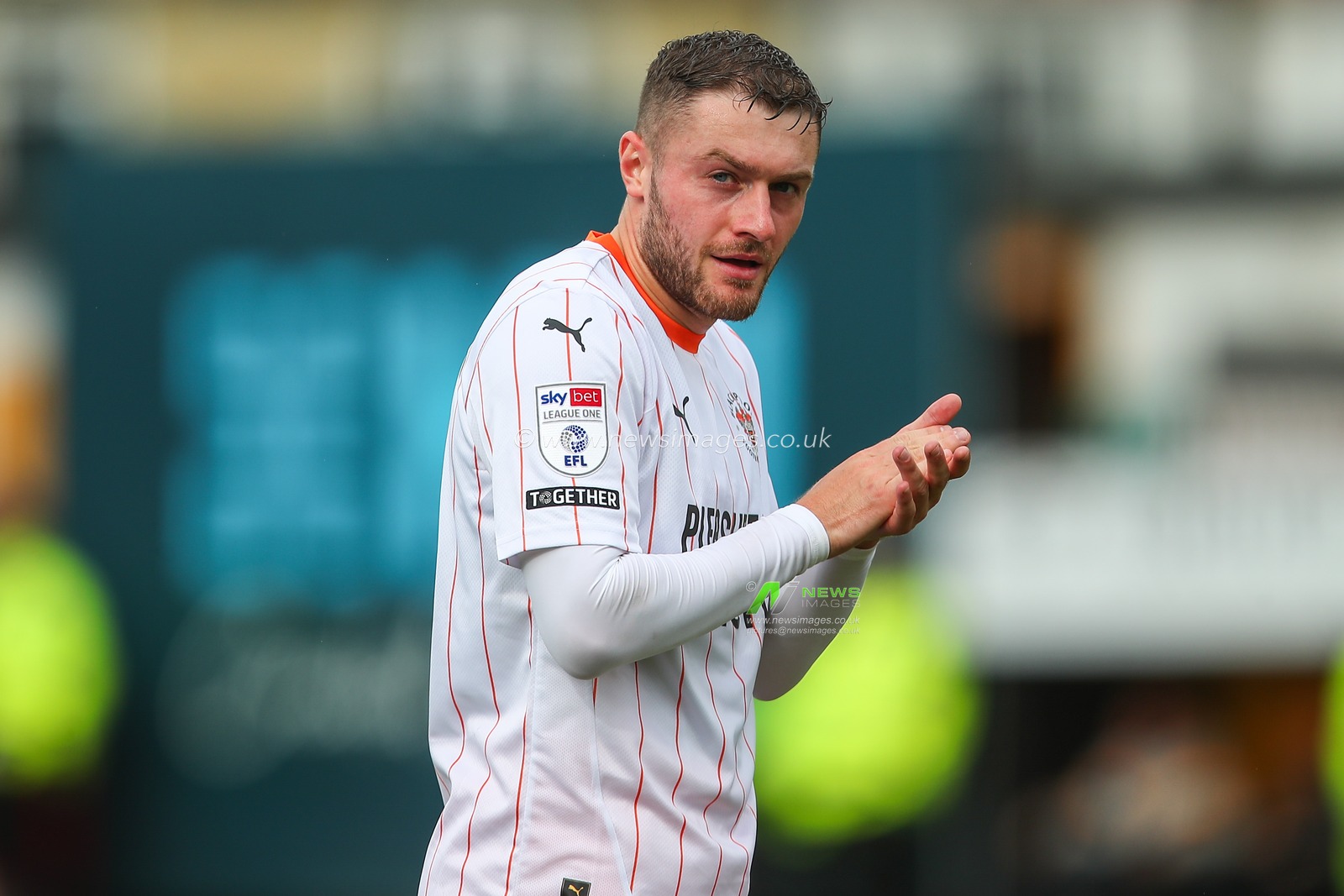 Elliot Embleton of Blackpool applauds the travelling fans after the Sky Bet League 1 match Cambridge United vs Blackpool at Abbey Stadium, Cambridge, United Kingdom, 24th August 2024

(Photo by Gareth Evans/News Images)