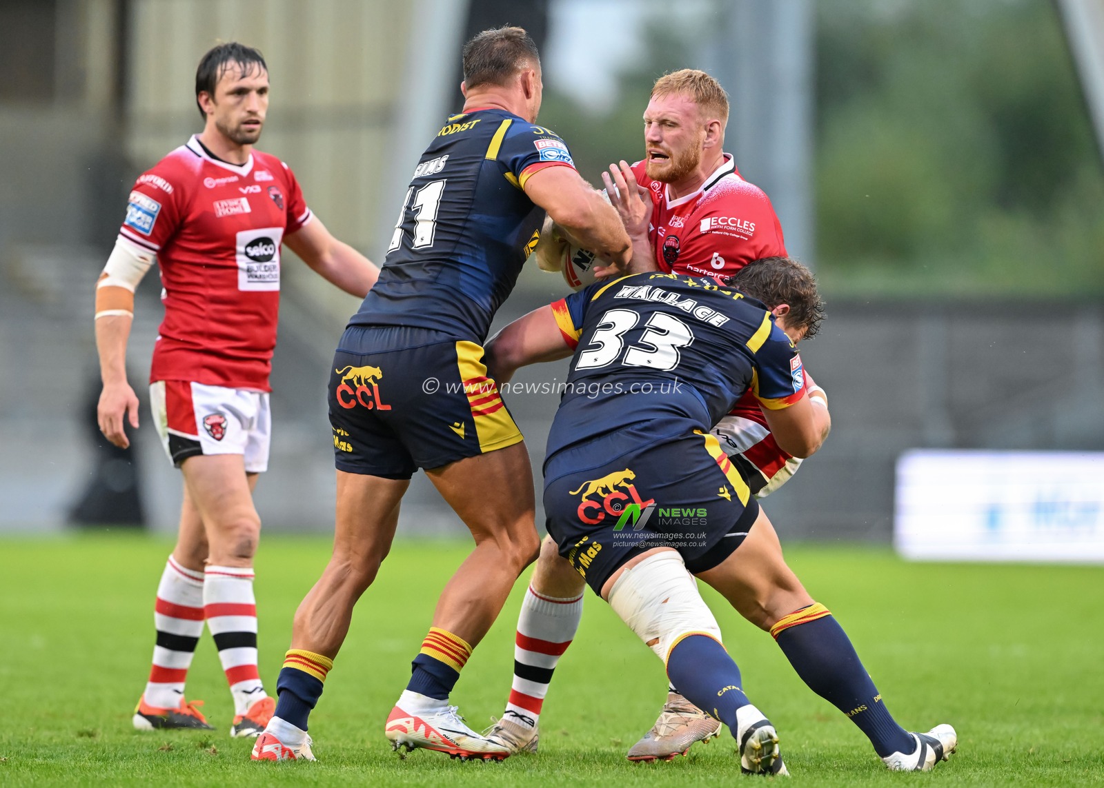 Joe Bullock of Salford Red Devils gets tackled during the Betfred Super League Round 25 match Salford Red Devils vs Catalans Dragons at Salford Community Stadium, Eccles, United Kingdom, 7th September 2024

(Photo by Cody Froggatt/News Images)