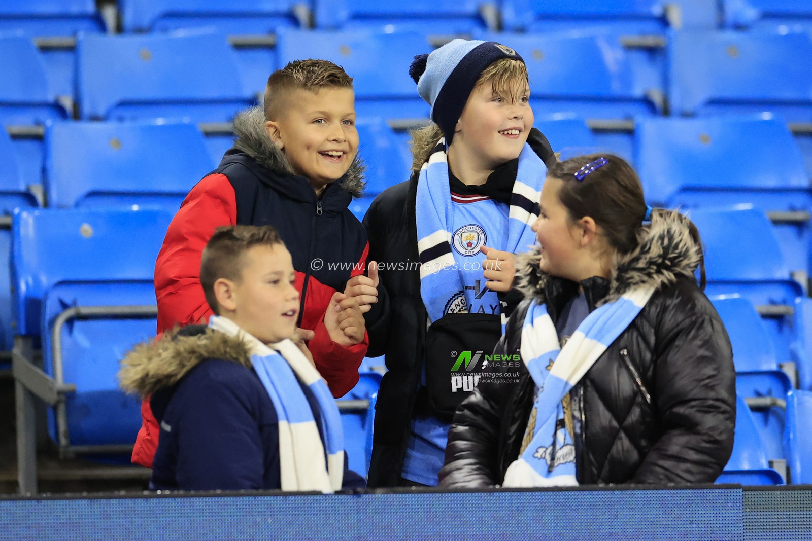 Group of young City fans ahead of the UEFA Champions League match Manchester City vs Sevilla at Etihad Stadium, Manchester, United Kingdom, 2nd November 2022

(Photo by Conor Molloy/News Images)