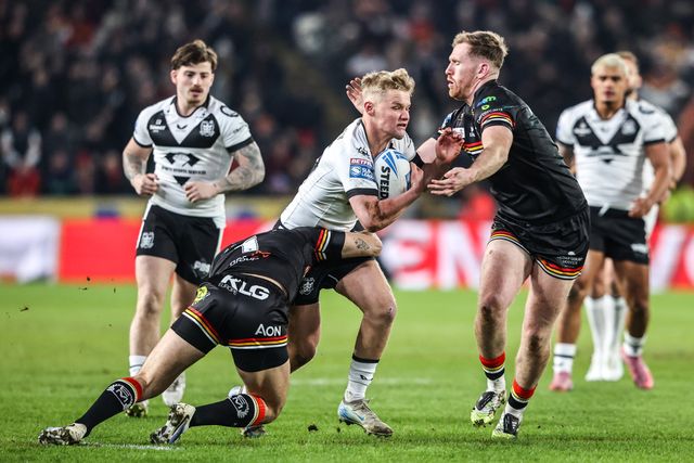 Callum Kemp of Hull FC is tackled by Rowan Milnes of Bradford Bulls and Caleb Aekins of Bradford Bulls during the Betfred Super League round 1 match Hull FC vs Bradford Bulls at MKM Stadium, Hull, United Kingdom on 14 February 2026

(Photo by Alfie Cosgrove/News Images)