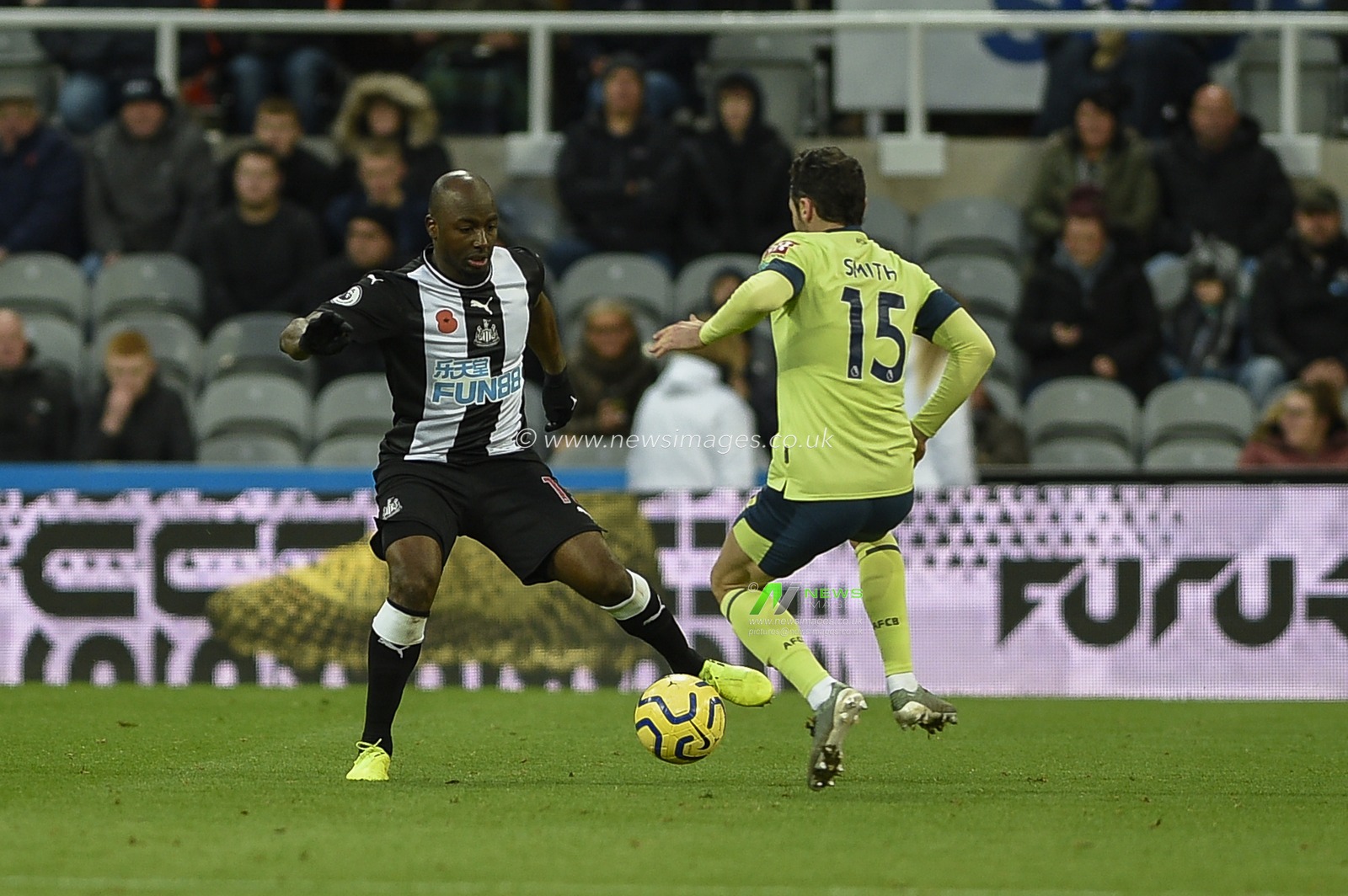 9th November 2019, St. James's Park, Newcastle, England; Premier League, Newcastle United v Bournemouth : Jetro Willems (15) of Newcastle United and Adam Smith (15) of Bournemouth both go for the ball

Credit: Iam Burn/News Images