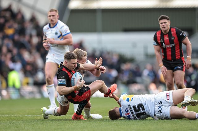 George Williams of Warrington Wolves is tackled by Lachie Miller of Leeds Rhinos during the Betfred Super League round 6 match Leeds Rhinos vs Warrington Wolves at AMT Headingley Stadium, Leeds, United Kingdom on 29 March 2026

(Photo by Mark Cosgrove/News Images)