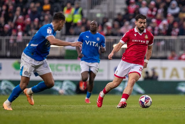 Wrexham's Elliot Lee carries the ball during the Sky Bet League 1 match Wrexham vs Stockport County at SToK Cae Ras, Wrexham, United Kingdom, 22nd March 2025

(Photo by Nik Mesney/News Images)