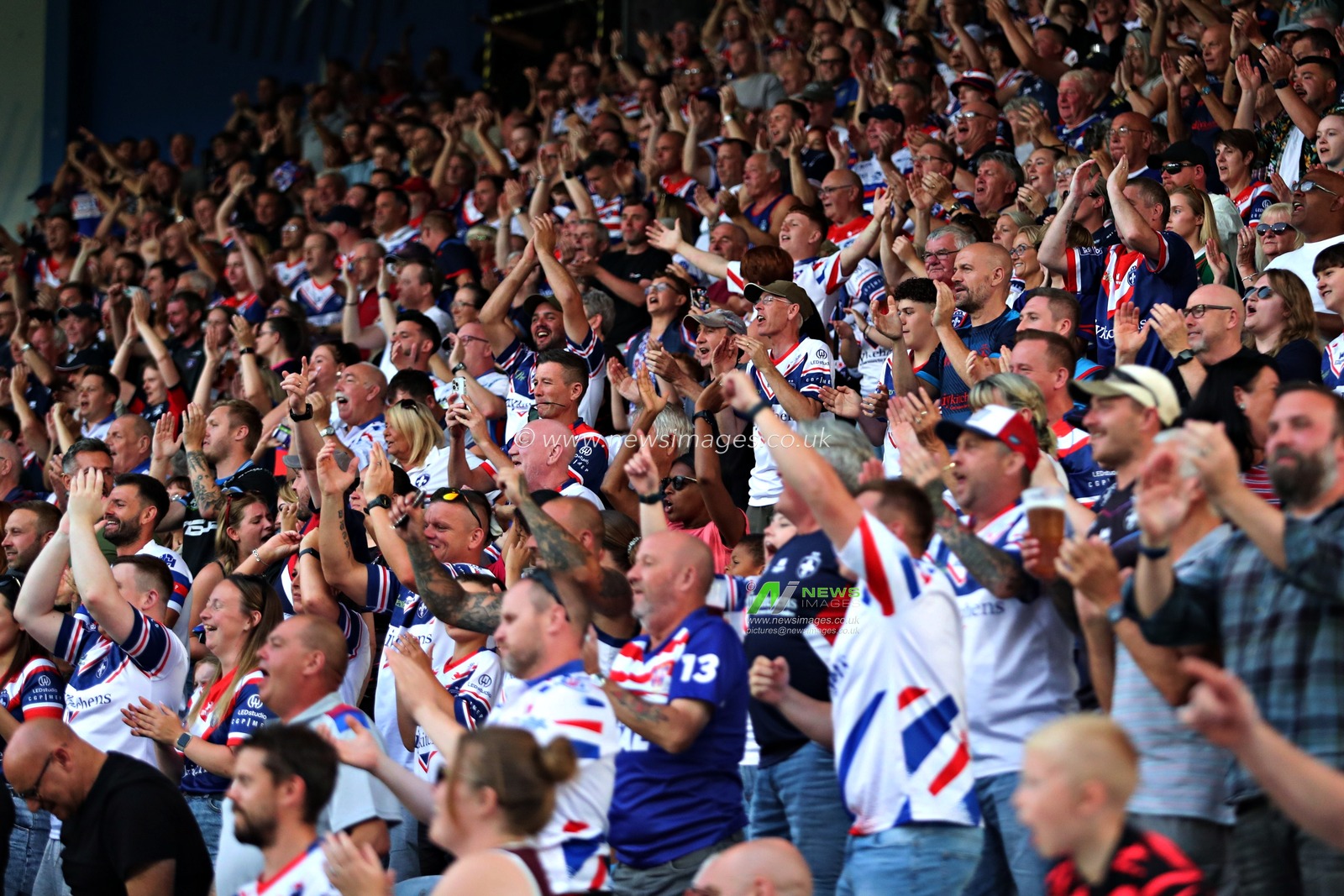 Wakefield fans celebrate during the Betfred Super League round 19 match Huddersfield Giants vs Wakefield Trinity at the Accu Stadium, Huddersfield, United Kingdom, 18th July 2025(Photo by Sam Eaden/News Images)