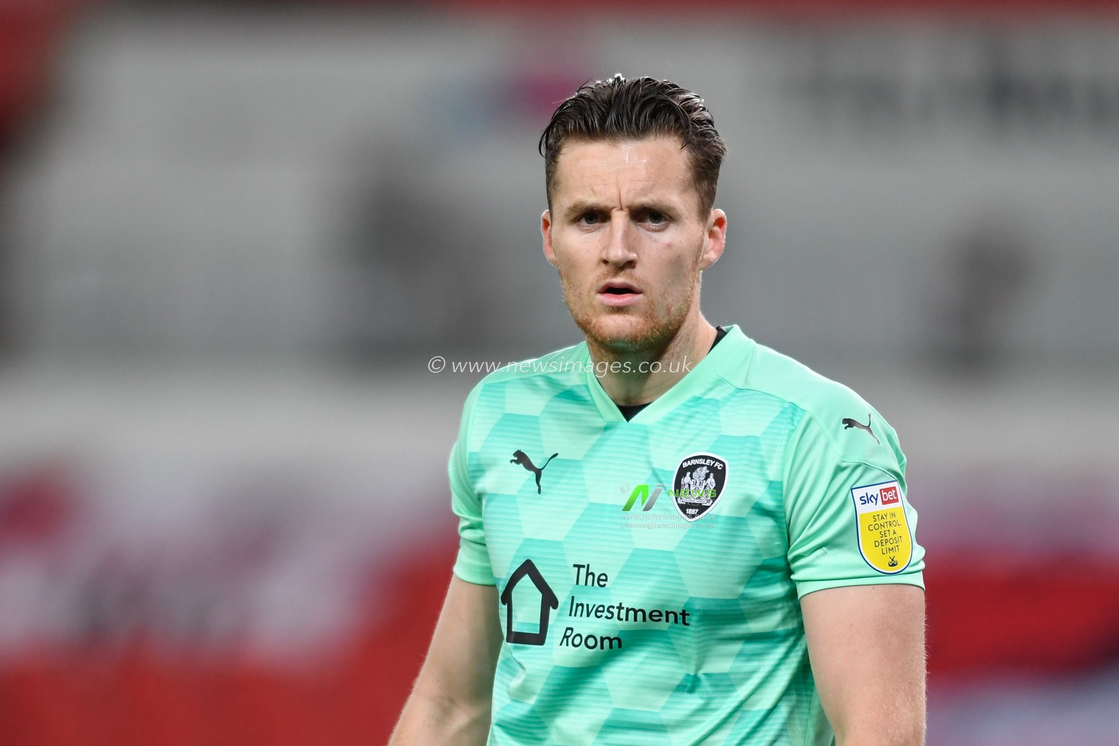 Jack Walton (1) of Barnsley in action during the game