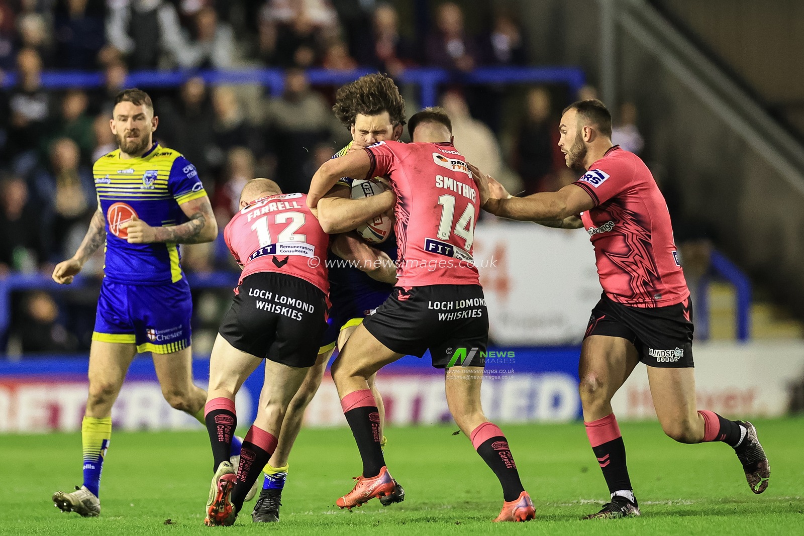 Rob Mulhern #19 of Warrington Wolves barges into Morgan Smithies #14 of Wigan Warriors