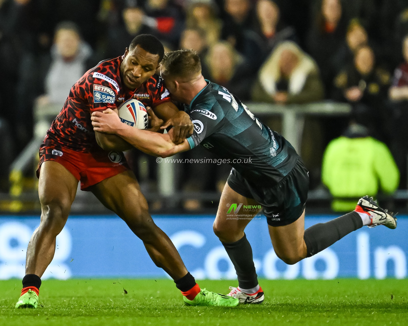 Edwin Ipape of Leigh Leopards is tackled by Adam Milner of Huddersfield Giants during the Betfred Super League Round 1 match Leigh Leopards vs Huddersfield Giants at Leigh Sports Village, Leigh, United Kingdom, 16th February 2024

(Photo by Craig Thomas/News Images)