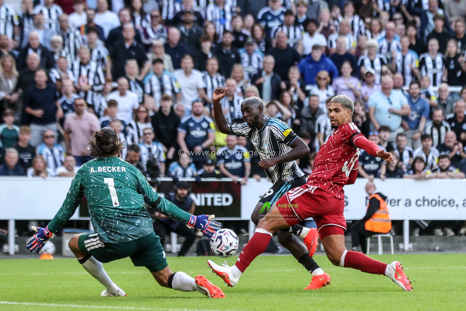 Liverpool goalkeeper Alisson Becker blocks a shot on goal from Yoane Wissa of Newcastle United during the Premier League match Newcastle Untied vs Liverpool at St. James's Park, Newcastle, United Kingdom on 23 August 2026

(Photo by Alfie Cosgrove/News Images)