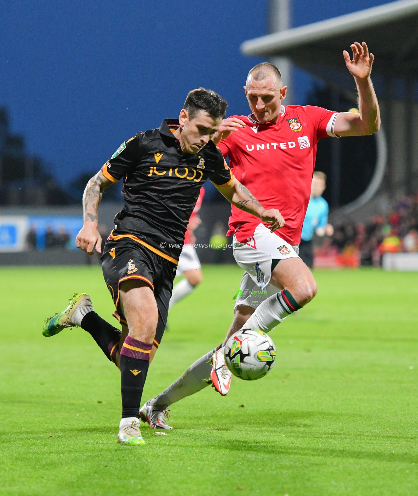 Bradfordâ€™s Jamie Walker runs down the wing while being chased down by Wrexham's William Boyle, during the Carabao Cup match Wrexham vs Bradford City at The Racecourse Ground, Wrexham, United Kingdom, 29th August 2023

(Photo by Cody Froggatt/News Images)