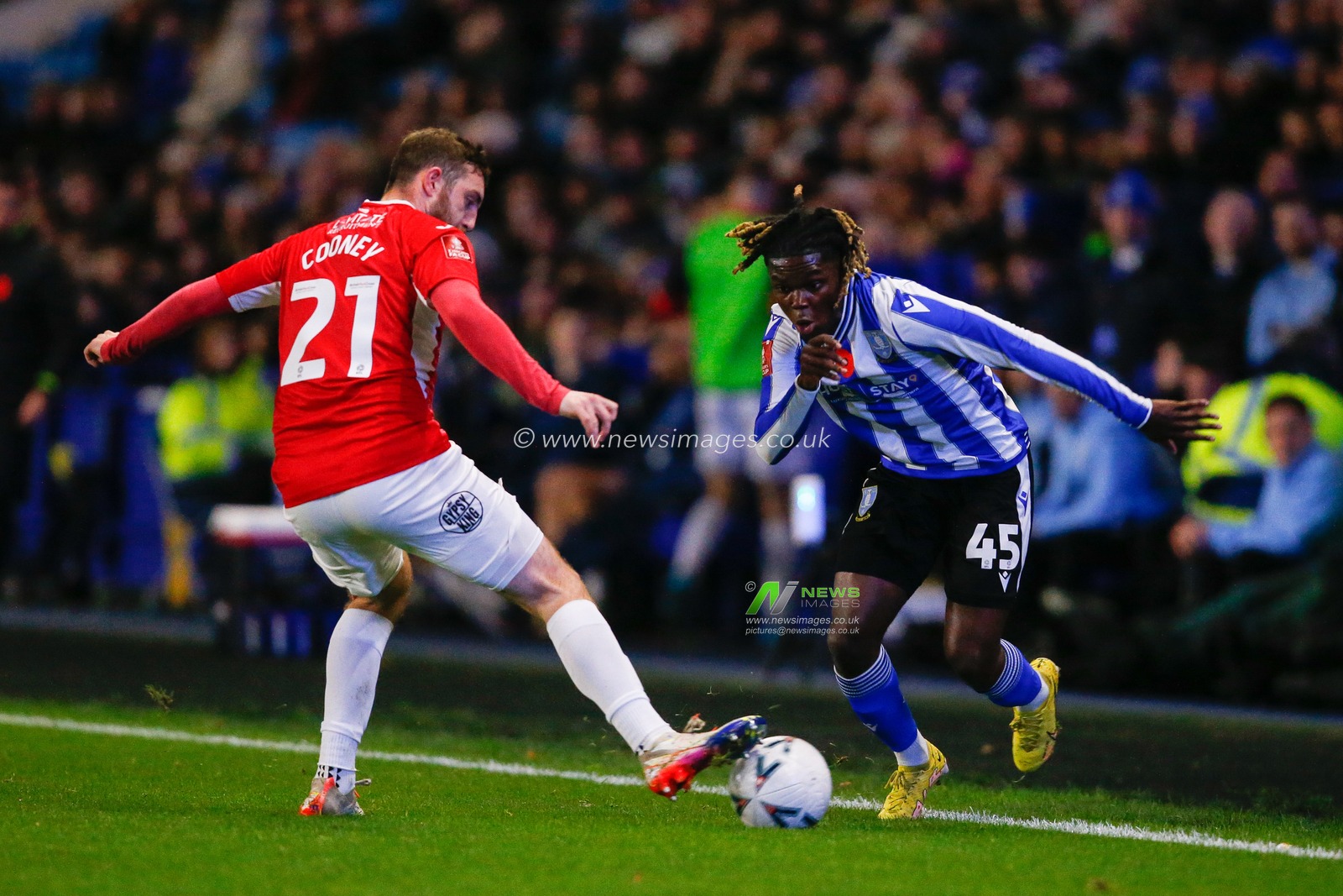 Alex Mighten #45 of Sheffield Wednesday and Ryan Cooney #21 of Morecambe during the Emirates FA Cup match Sheffield Wednesday vs Morecambe at Hillsborough, Sheffield, United Kingdom, 4th November 2022

(Photo by Ben Early/News Images)