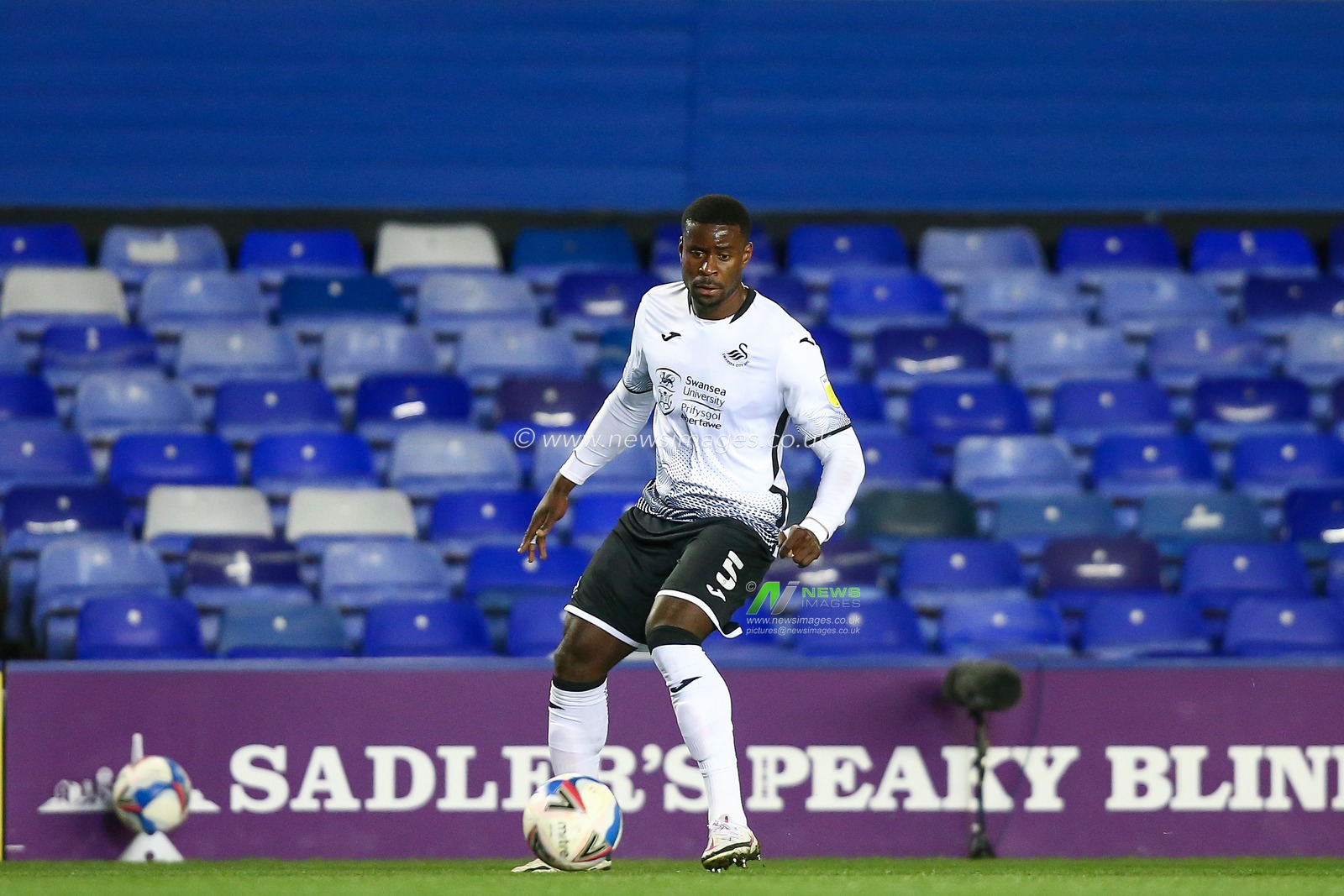 Marc Guehi #5 of Swansea City dribbles the ball