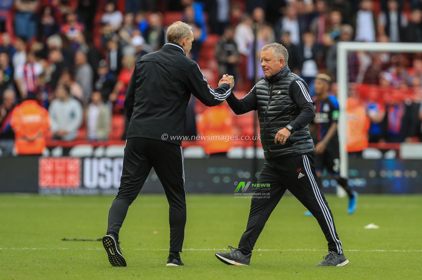 18th August 2019 , Bramall Lane, Sheffield, England; Premier League Football, Sheffield United vs Crystal Palace ; Chris Wilder manager of Sheffield United and Alan Knill celebrate they 1-0 win on their Premier League home debut  


Credit: Mark Cosgrove/News Images

English Football League images are subject to DataCo Licence