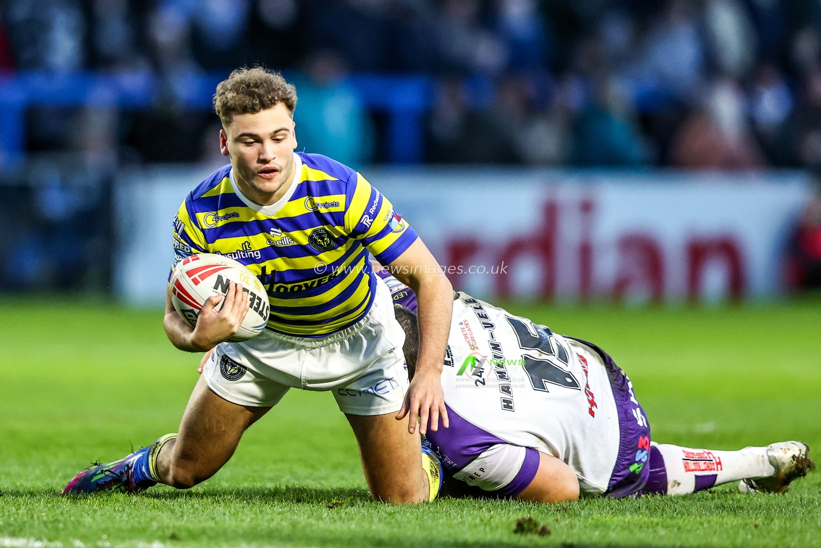 Cai Taylor-Wray of Warrington Wolves is tackled by Caleb Hamlin-Uele of Wakefield Trinity during the Betfred Super League Round 3 match Warrington Wolves vs Wakefield Trinity at The Halliwell Jones Stadium, Warrington, United Kingdom on 28 February 2026

(Photo by Alfie Cosgrove/News Images)