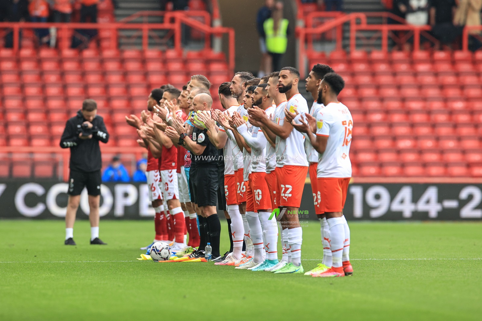 Both teams hold a minutes applause in memory of Terry Cooper