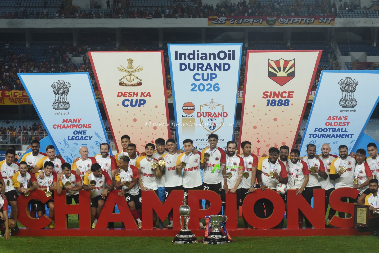 East Bengal FC players celebrate with the championship trophy after winning the 135th Durand Cup final against Mohun Bagan Super Giant at the Vivekananda Yuba Bharati Krirangan in Kolkata, India, August 23, 2026. Photo by Debajyoti Chakraborty.(Photo: Debajyoti Chakraborty/News Images)