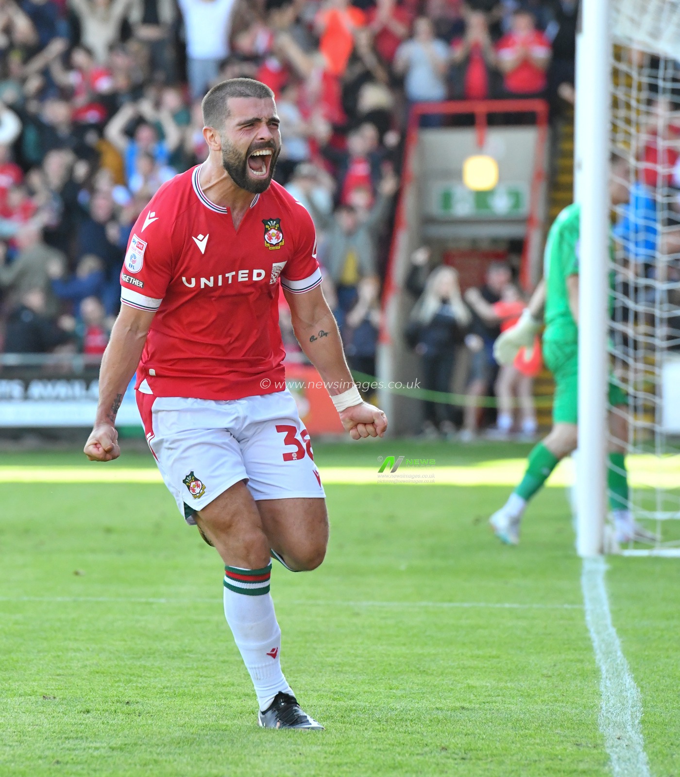 Wrexham's Elliot Lee celebrates his injury time equalising goal, during the Sky Bet League 2 match Wrexham vs Swindon Town at The Racecourse Ground, Wrexham, United Kingdom, 19th August 2023

(Photo by Cody Froggatt/News Images)