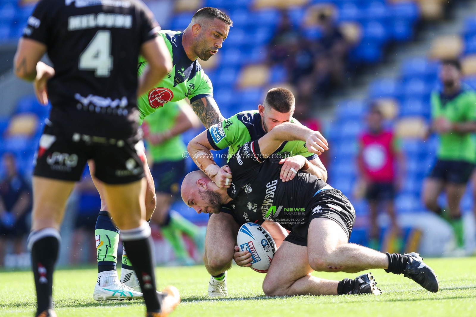 John Bateman and Danny Walker of Warrington Wolves make a tackle during the Betfred Super League Round 21 match London Broncos vs Warrington Wolves at Plough Lane, Wimbledon, United Kingdom, 11th August 2024

(Photo by Izzy Poles/News Images)