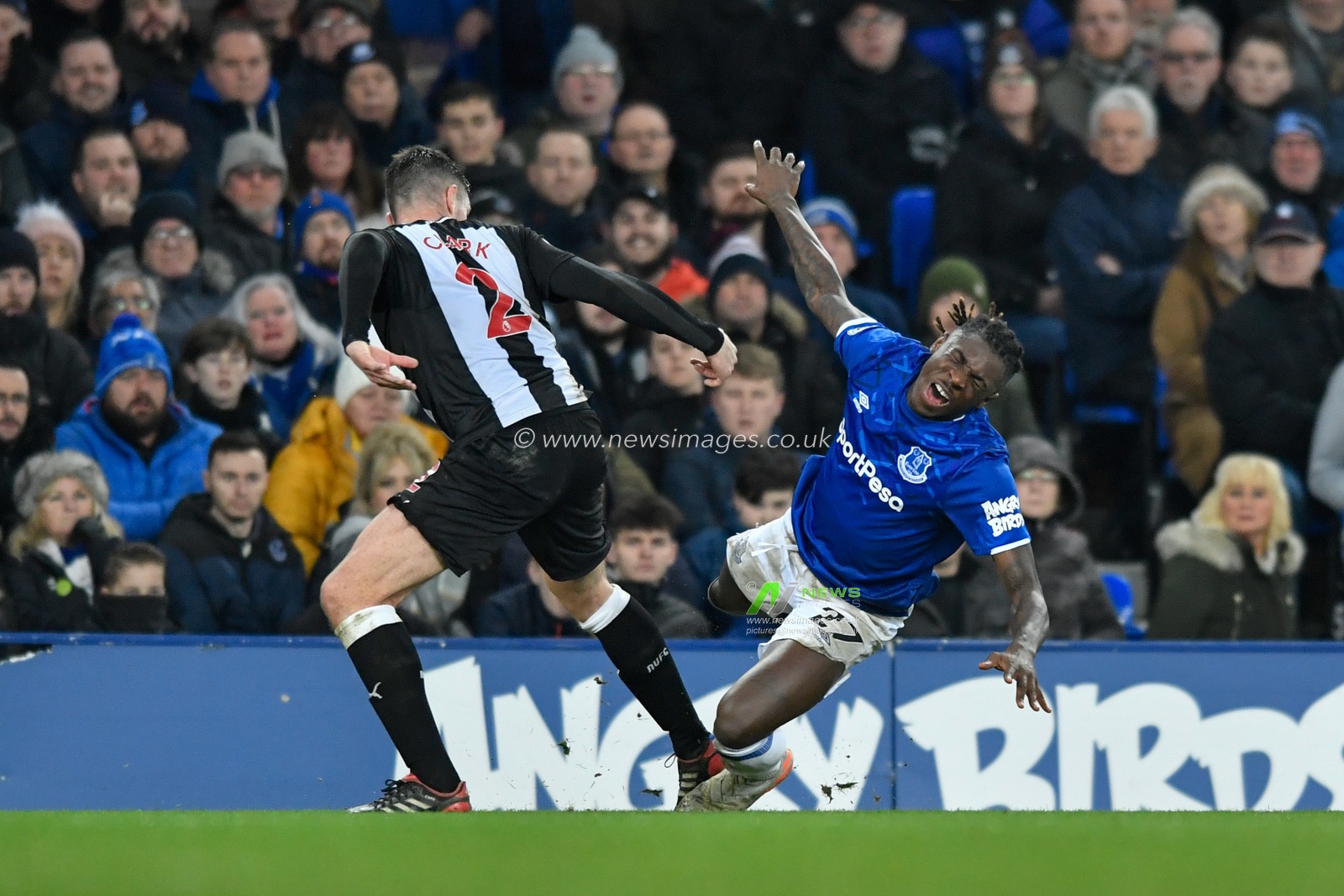21st January 2020, Goodison Park, Liverpool, England; Premier League, Everton v Newcastle United : Moise Kean (27) of Everton falls under the challenge from Ciaran Clark (2) of Newcastle United