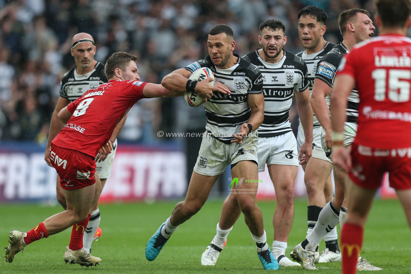 Matt Parcell (9) of Hull KR tries to stop Carlos Tuimavave (3) of Hull FC