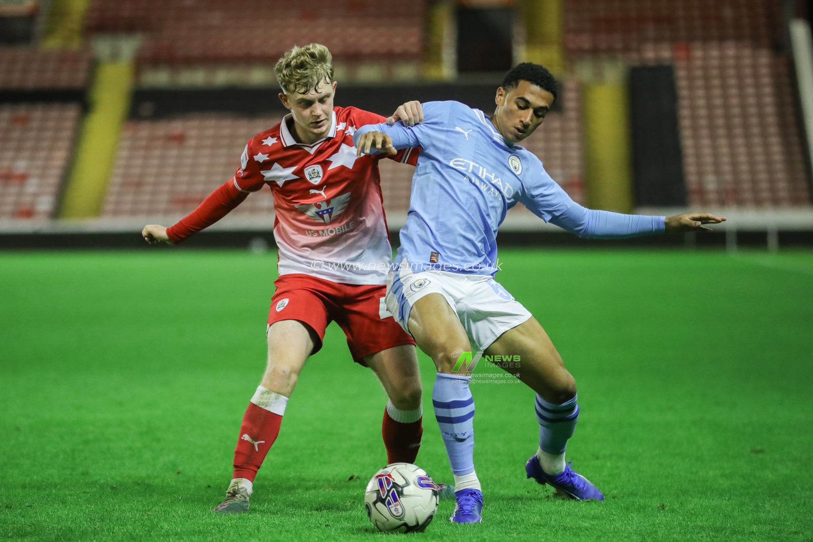 Hayden Packard #46 of Barnsley pressures the ball during the EFL Trophy match Barnsley vs Manchester City U21 at Oakwell, Barnsley, United Kingdom, 26th September 2023

(Photo by Alfie Cosgrove/News Images)