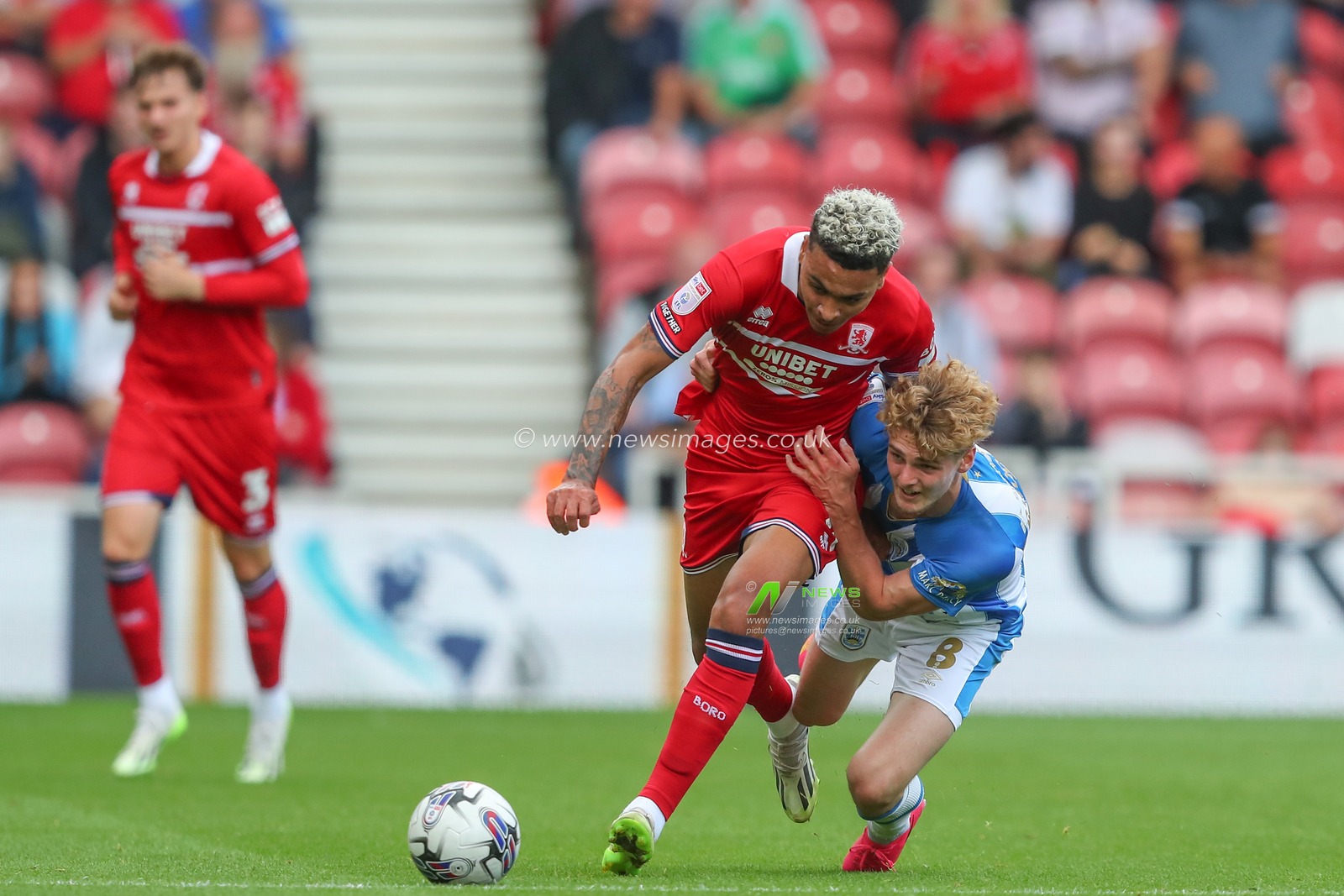 Jack Rudoni #8 of Huddersfield Town fouls Morgan Rogers #10 of Middlesbrough during the Sky Bet Championship match Middlesbrough vs Huddersfield Town at Riverside Stadium, Middlesbrough, United Kingdom, 19th August 2023

(Photo by Gareth Evans/News Images)
