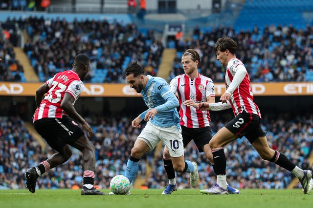 Rayan Cherki of Manchester City dribbles past Michael Kayode of Brentford and Aaron Hickey of Brentford during the Premier League match Manchester City vs Brentford at The City in the Community Etihad Stadium, Manchester, United Kingdom on 09 May 2026

(Photo by Jorge Horsted/News Images)