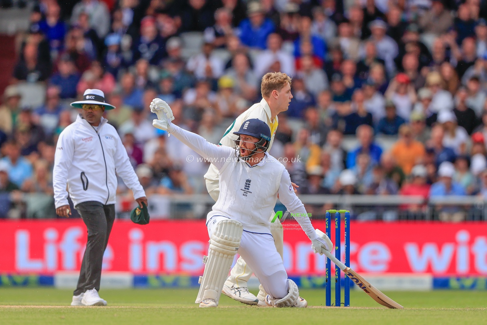 Jonny Bairstow of England holds back James Anderson of England at the other end during the LV= Insurance Ashes Fourth Test Series Day Three Test Series match England vs Australia at Old Trafford, Manchester, United Kingdom, 21st July 2023

(Photo by Conor Molloy/News Images)