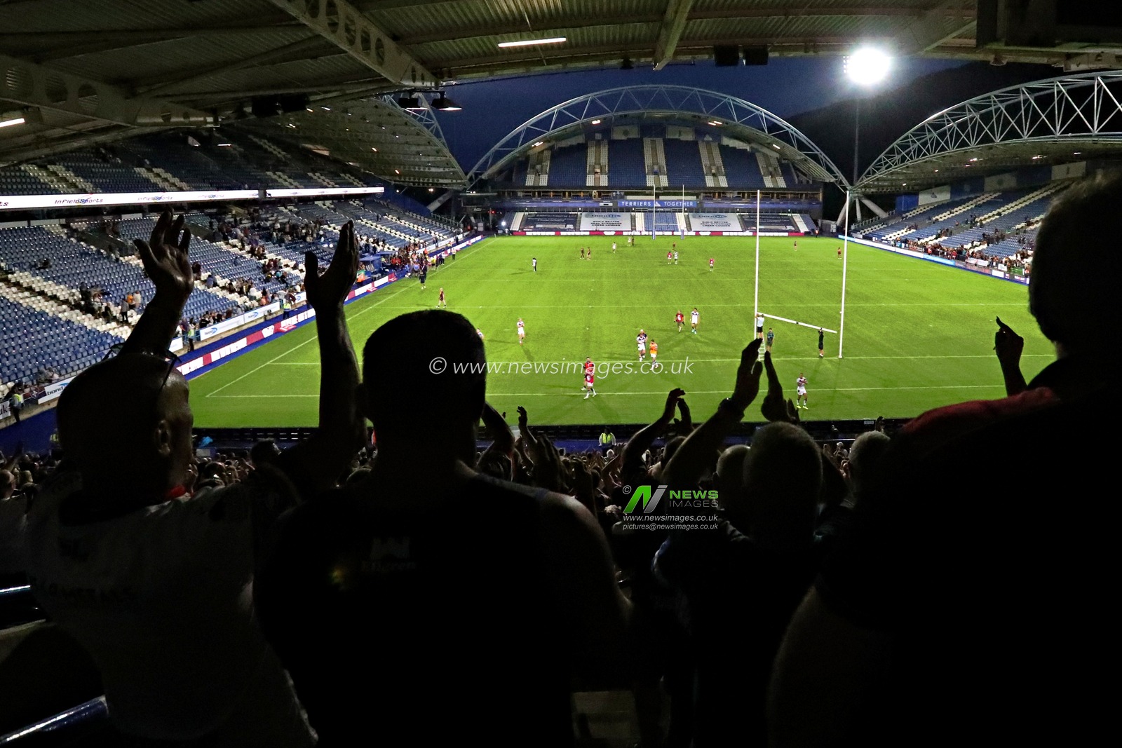 Wakefield fans celebrate after the Betfred Super League round 19 match Huddersfield Giants vs Wakefield Trinity at the Accu Stadium, Huddersfield, United Kingdom, 18th July 2025

(Photo by Sam Eaden/News Images)