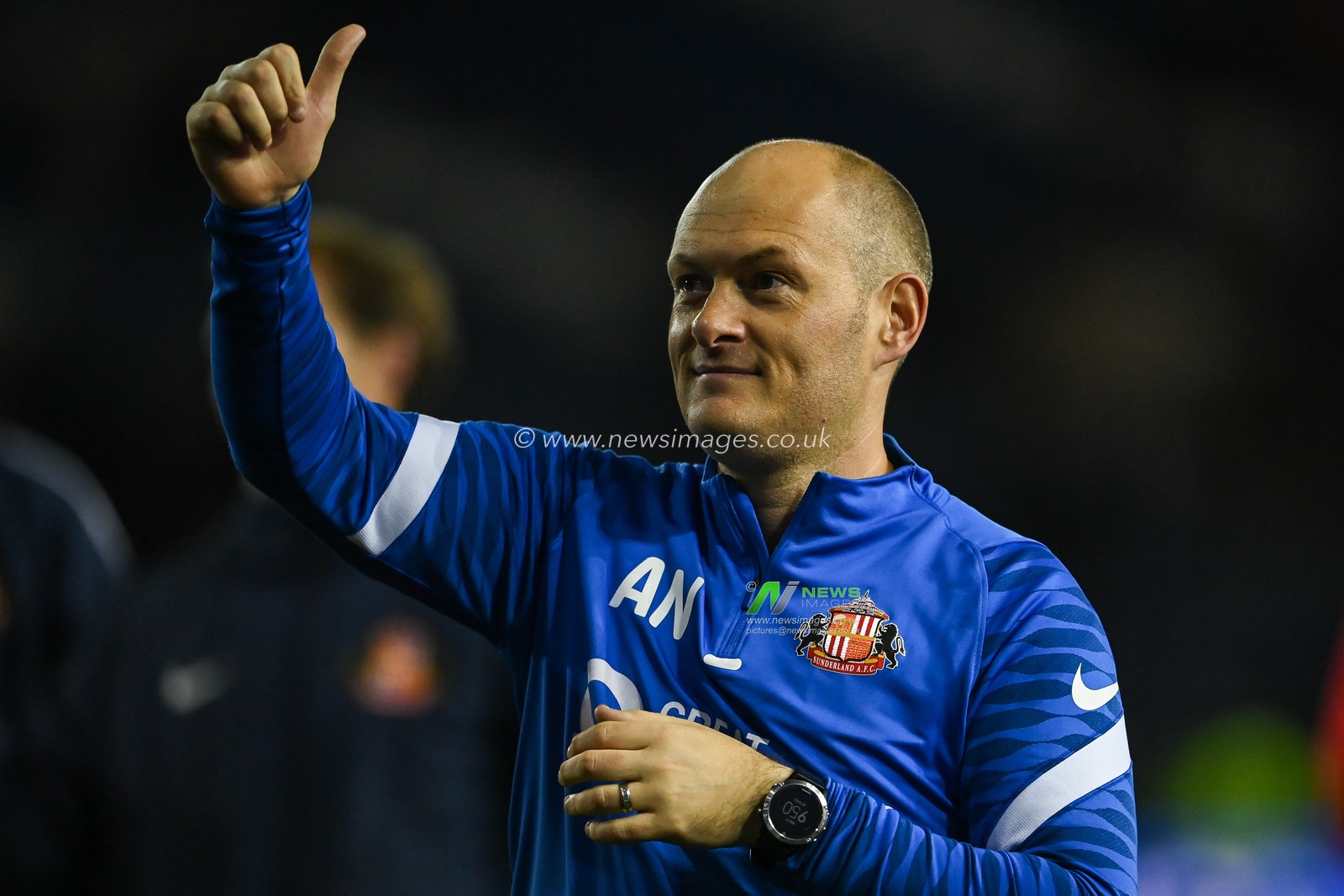 Alex Neil manager of Sunderland celebrates his sides victory in the play off semi final with a thumbs up to the fans