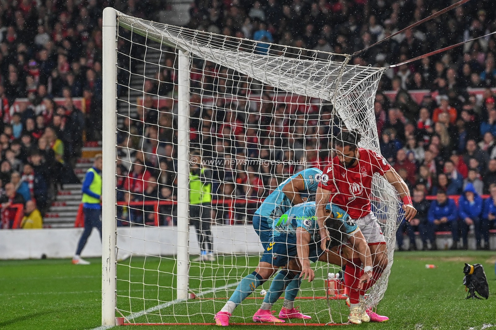 Southampton players rush to get the ball out of the net to restart the game during the Premier League match Nottingham Forest vs Southampton at City Ground, Nottingham, United Kingdom, 8th May 2023

(Photo by Craig Thomas/News Images)