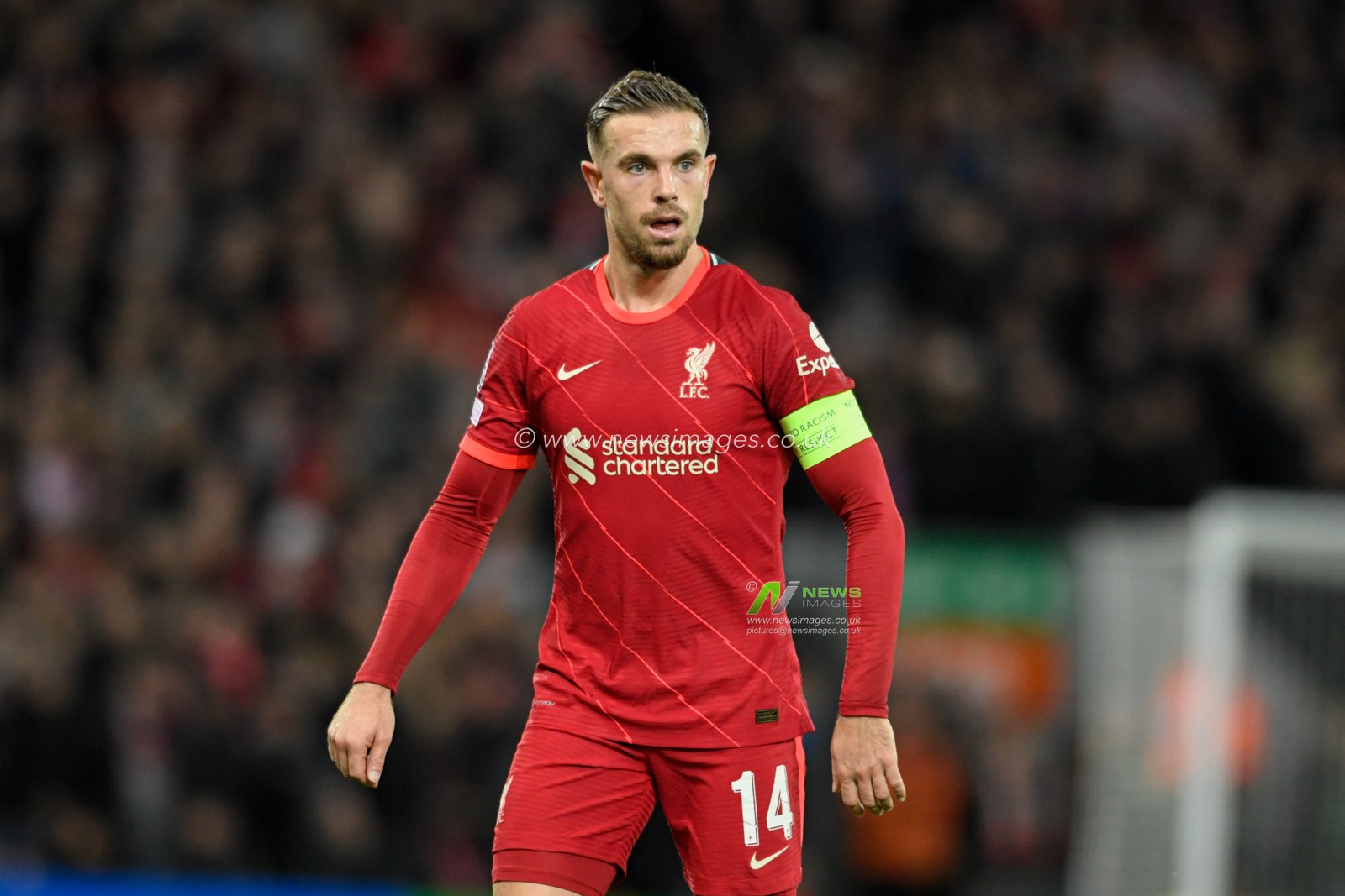 Jordan Henderson #14 of Liverpool in action during the game