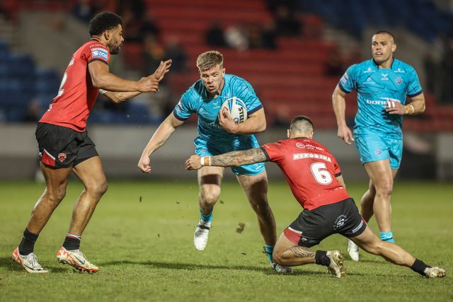 Harry Rushton of Huddersfield Giants is tackled by Kallum Watkins of Salford Red Devils and Jayden Nikorima of Salford Red Devils during the Betfred Super League Round 5 match Salford Red Devils vs Huddersfield Giants at Salford Community Stadium, Eccles, United Kingdom, 20th March 2025

(Photo by Alfie Cosgrove/News Images)