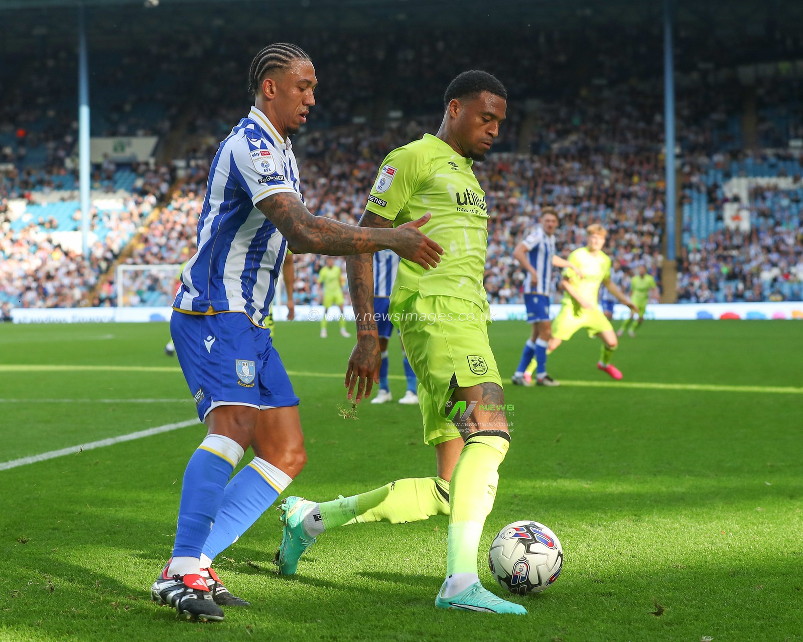 Delano Burgzorg #7 of Huddersfield Town holds off Liam Palmer #2 of Sheffield Wednesday during the Sky Bet Championship match Sheffield Wednesday vs Huddersfield Town at Hillsborough, Sheffield, United Kingdom, 7th October 2023

(Photo by Gareth Evans/News Images)