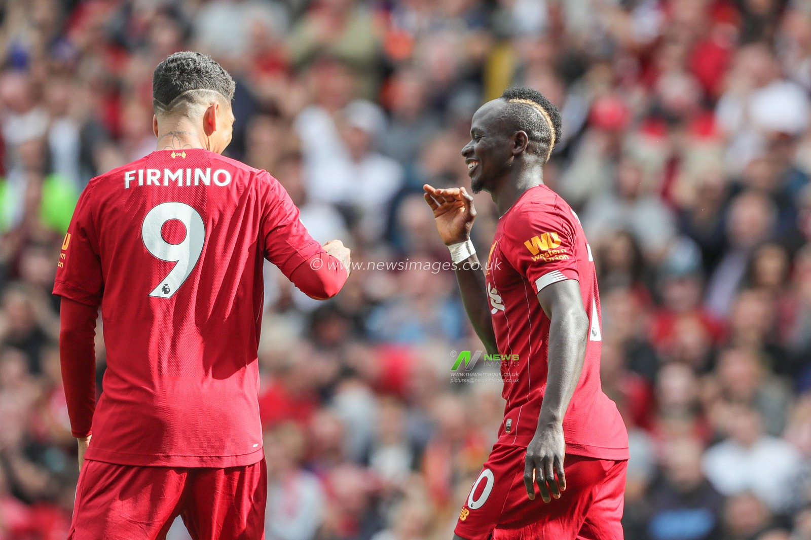14th September 2019 , Anfield, Liverpool, England; Premier League Football, Liverpool vs Newcastle United ; Sadio Mane (10) of Liverpool  celebrates his goal to make it 2-1 with Roberto Firmino (9) of Liverpool  


Credit: Mark Cosgrove/News Images 


Premier League/EFL Football images are subject to DataCo Licence
