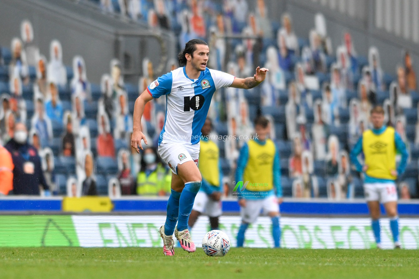 Lewis Travis (27) of Blackburn Rovers runs forward with the ball