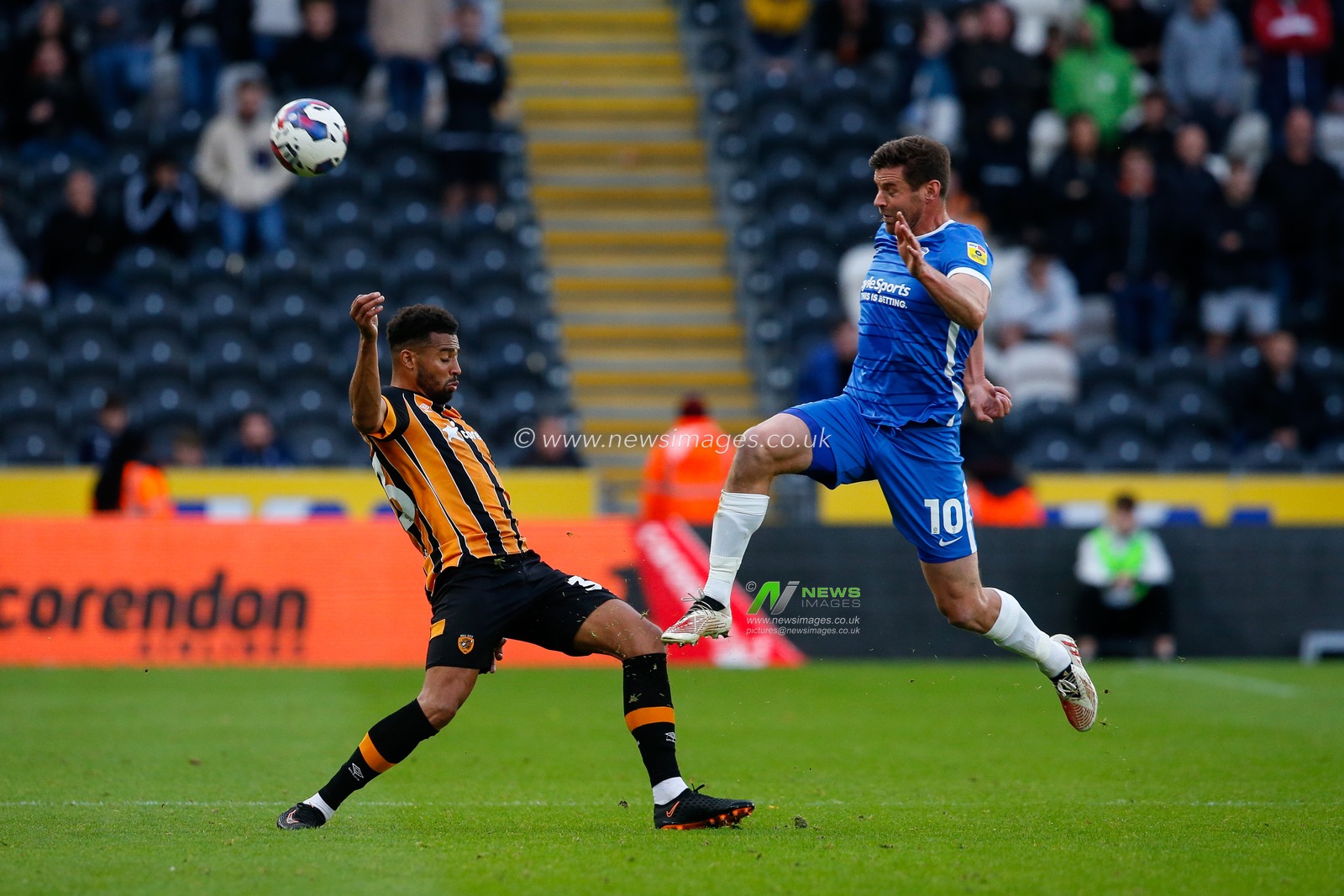 Cyrus Christie #33 of Hull City and Lukas Jutkiewicz #10 of Birmingham City during the Sky Bet Championship match Hull City vs Birmingham City at MKM Stadium, Hull, United Kingdom, 16th October 2022

(Photo by Ben Early/News Images)