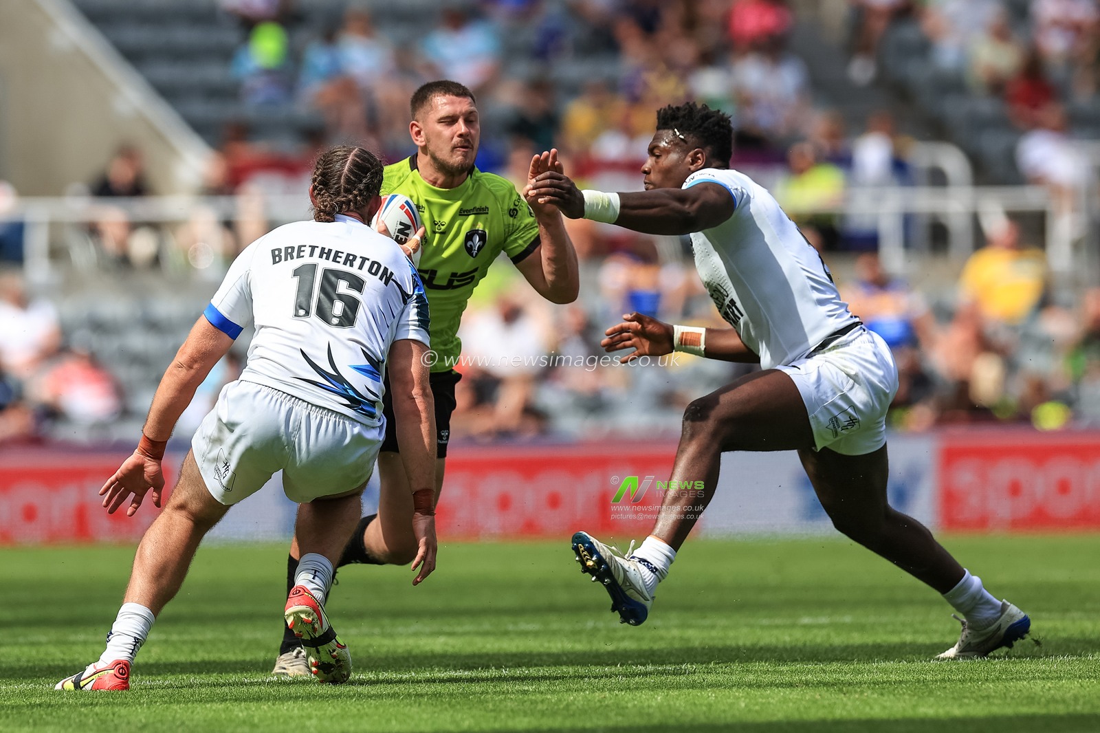 Brad Walker #21 of Wakefield Trinity barges into Nathan Peets #28 of Toulouse Olympique