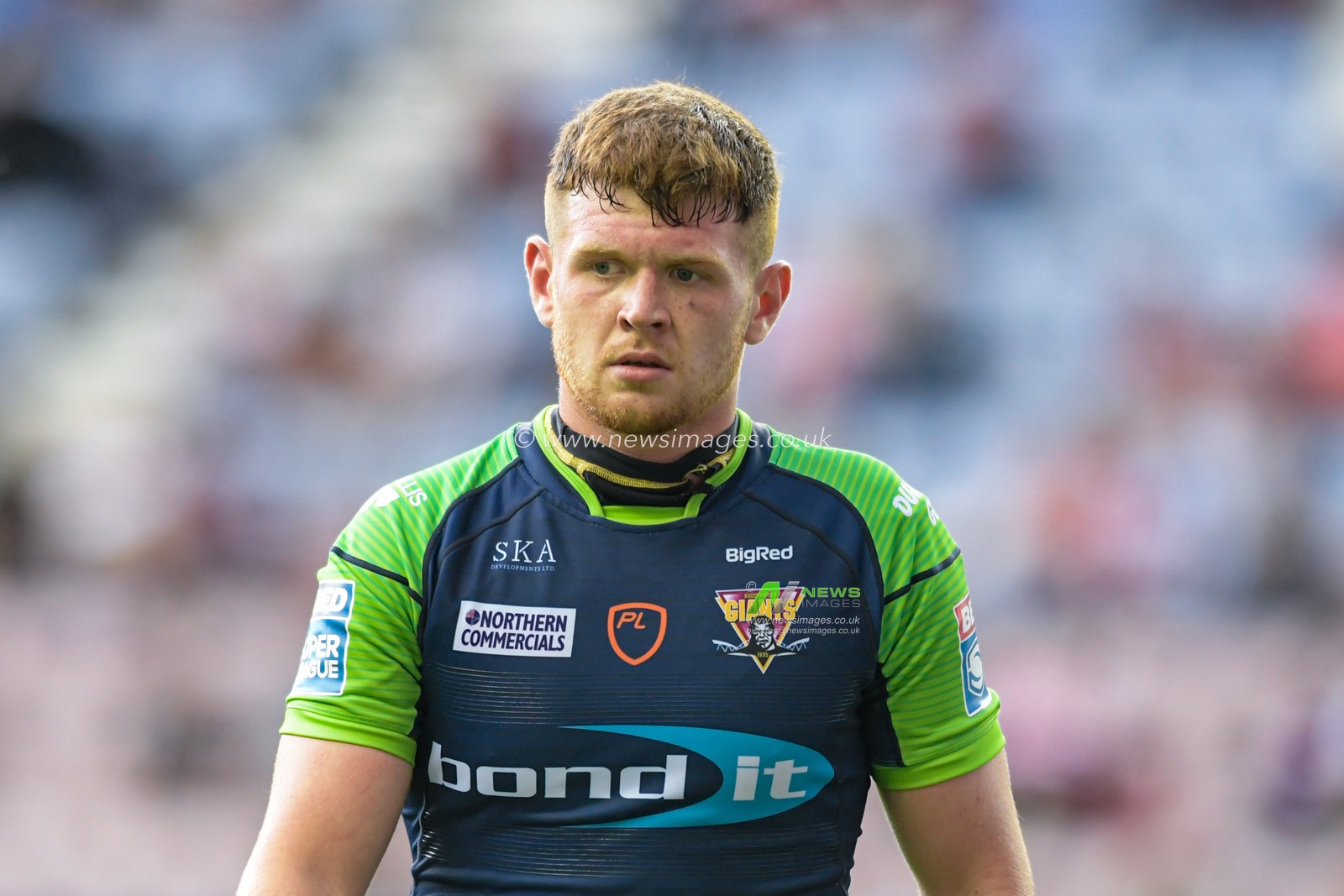 Oliver Russell (23) of Huddersfield Giants in action during the game