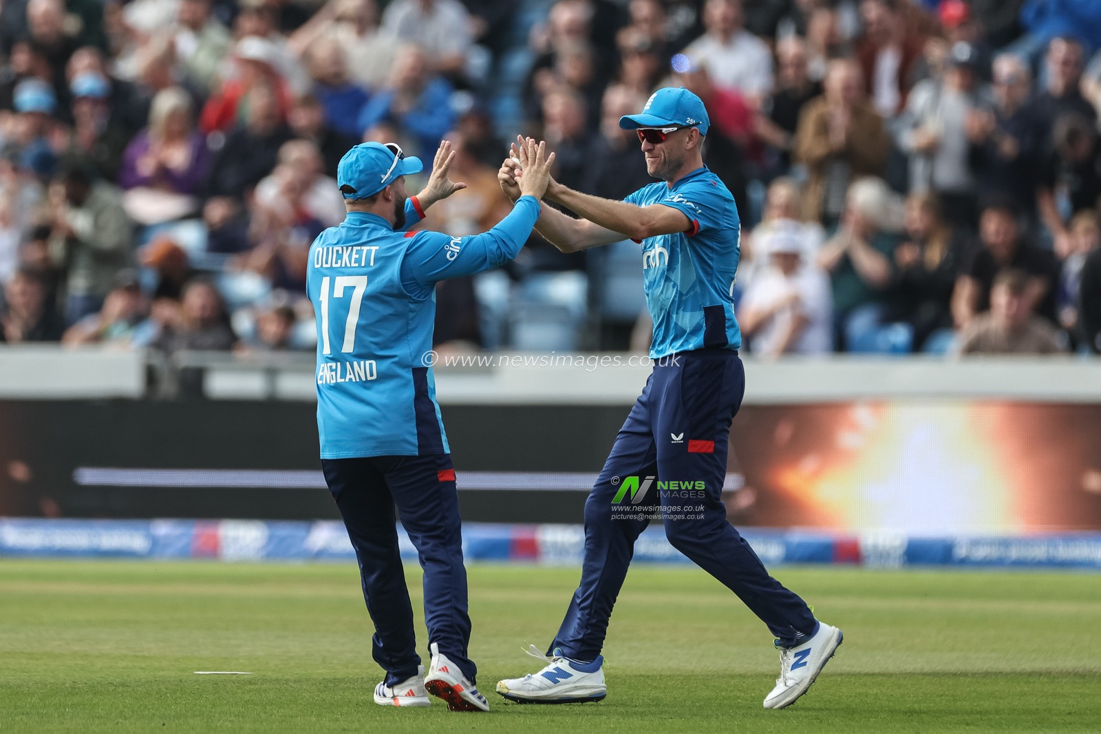 Olly Stone of England celebrates catching out Travis Head of Australia with Ben Duckett of England  during the Second Metro Bank One Day International England v Australia at Headingley Cricket Ground, Leeds, United Kingdom, 21st September 2024

(Photo by Mark Cosgrove/News Images)