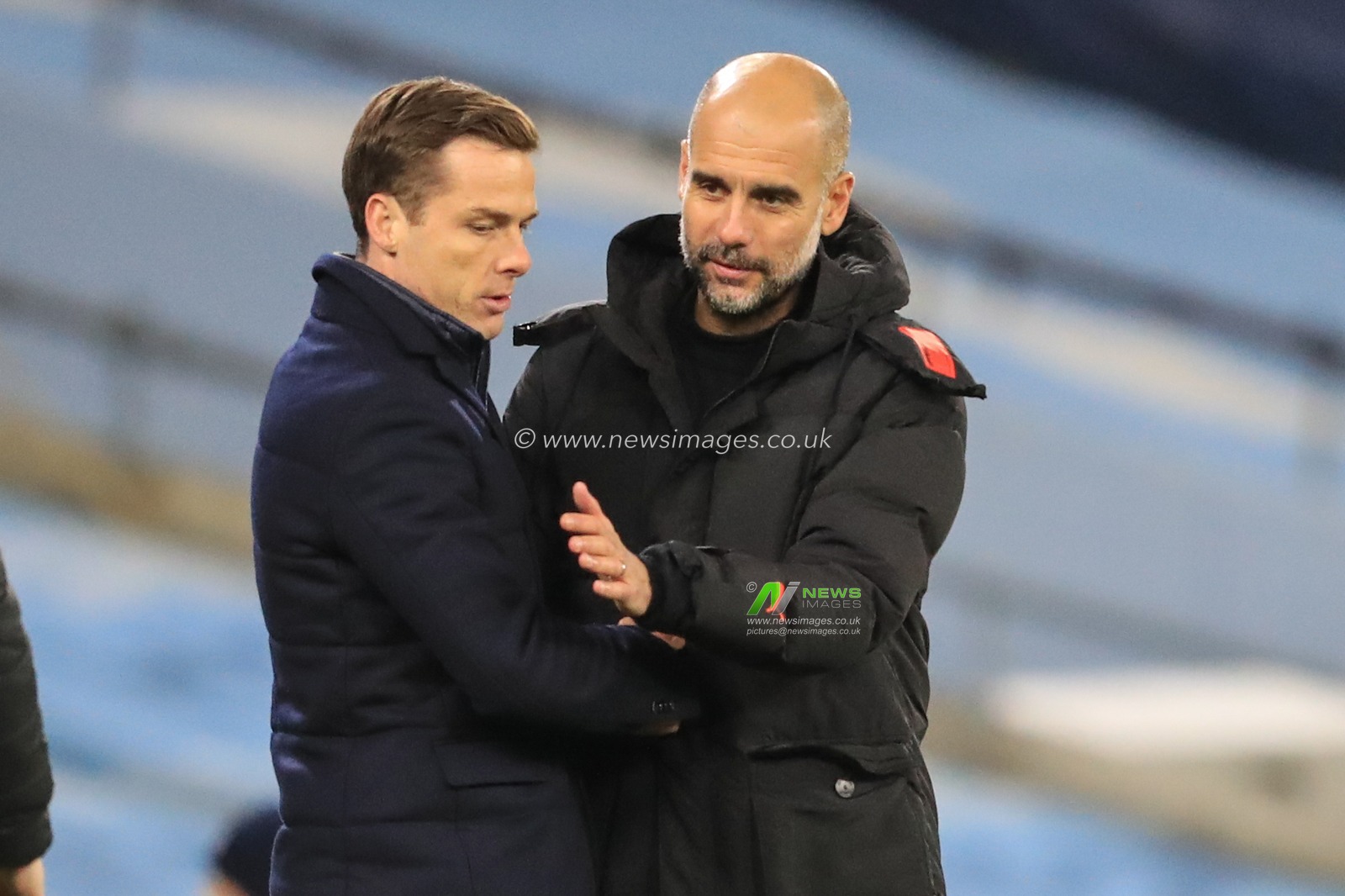 Josep Guardiola manager of Manchester City and Scott Parker manager of Fulham after Guardiolaâ€™s City win 2-0